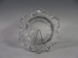 a clear glass candle holder on a white table