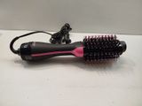 a hair dryer that is sitting on a table