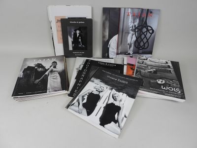 several black and white photographs of a man and a woman on a table