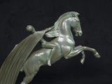 a statue of a horse with wings on it ' s back