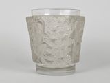 a glass cup that is sitting on a table
