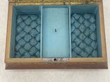 a blue box with a mirror inside of it on the floor