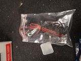 a bag of wires and a mouse on the floor