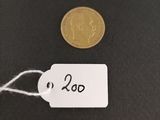 a close up of a coin with a price tag on it