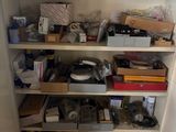 many boxes and boxes on the shelves in the closet
