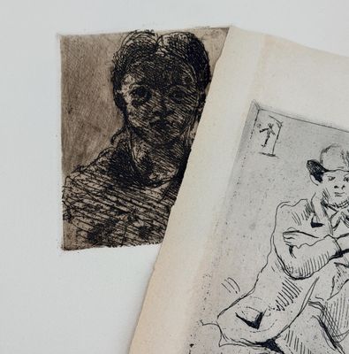 a drawing of a woman sitting on a chair next to a drawing of a man