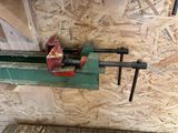 a clamp that is attached to a piece of wood