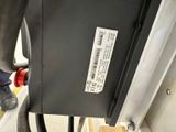 a gas pump that is connected to the side of a building