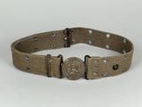 a belt with a metal buckle on it on a white surface