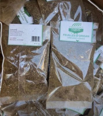 two bags of herbs in a box on a table