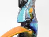 a bird that is sitting on top of a vase