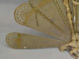 a gold peacock that is sitting on a table