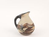 a small vase with a painting on it on a white surface