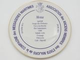 a plate with a menu on it sitting on a table
