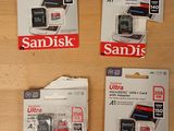 four sd cards sitting on top of each other on a table