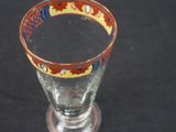 a glass with a red and blue design on it