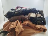 a pile of clothes sitting on top of a white table