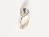 a close up of a ring with two diamonds on it