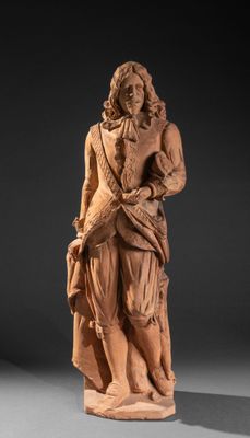 une image représentant la statue d'un homme tenant un chien dans ses bras