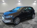 the volkswagen e - golf is parked in a garage with a checkered floor