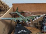 a small toy airplane sitting in a box on a table