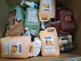a cardboard box filled with different types of cleaning products