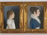 pair of portraits of a young girl and a young girl in a blue dress