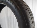 a close up of a tire on a white surface with a white background