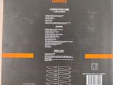 the back of a box with a picture of a black and orange package