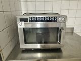a microwave that is sitting on a counter in a kitchen