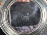 a close up view of a silver cup with a handle