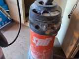a fire extinguisor sitting on the floor in a room