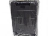 a piece of luggage wrapped in plastic on a white surface