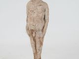 sculpture of a man standing on a wooden base with a white background
