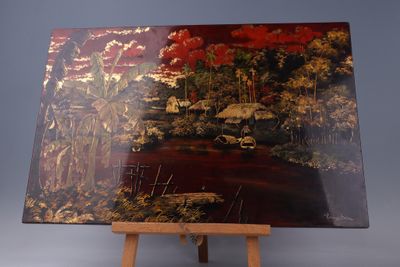 une photo d'un tableau posé sur un chevalet, sur lequel est représenté un tableau