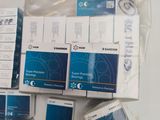 boxes of medical supplies are stacked on top of each other on a table