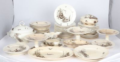 a lot of plates and bowls that are on a table