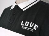 a black and white polo shirt with the word love moschius on it