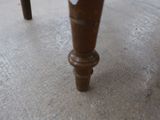 a close up view of a wooden table with a glass top
