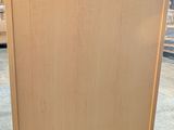 a picture of a wooden easel in a store