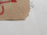 a piece of paper with a drawing of a person holding an umbrella