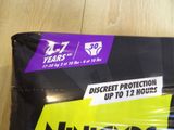 a package of underwear sitting on a wooden floor