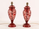 two red lamps that are sitting on a table
