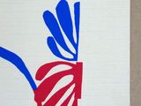 painting of a red, white and blue flower on a piece of paper