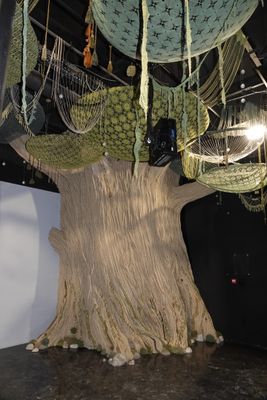 a sculpture of a tree that is made out of rope