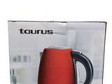 a box with a red tea kettle in it
