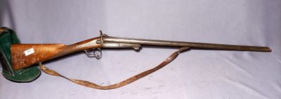 an old rifle with a wooden barrel on a white background