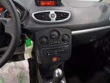 a dashboard of a small car with a steering wheel