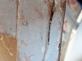 a close up of a piece of wood that is peeling off