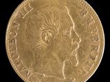 l'image d'une pièce d'or sur laquelle figure le visage d'une femme